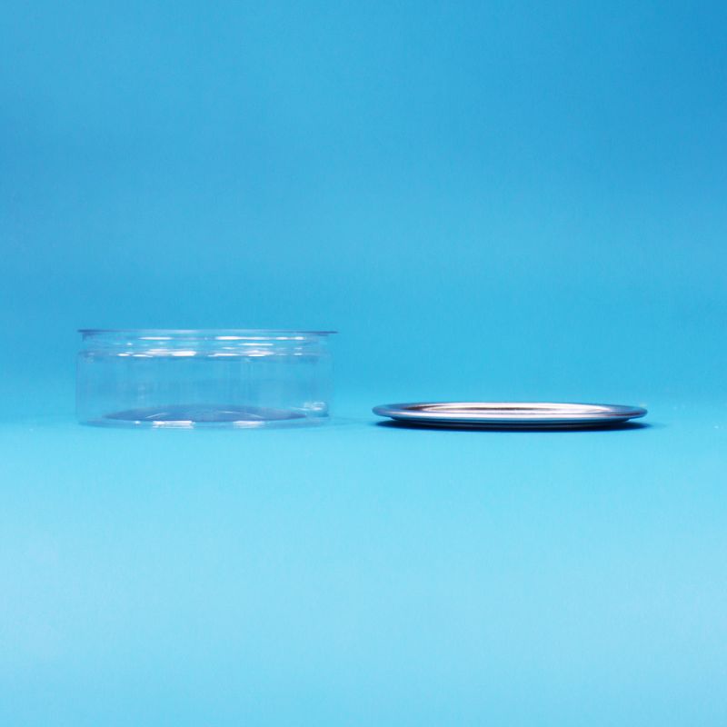 Okrągły plastikowy pojemnik PET z metalowym wieczkiem typu easy open do pakowania żywności, cukierków, ciasteczek i przekąsek